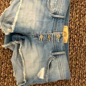 Button fly distressed denim jean shorts